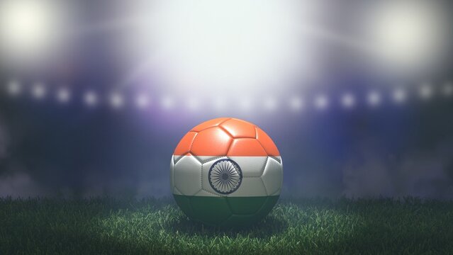 Soccer ball in flag colors on a bright blurred stadium background. India. 3D image