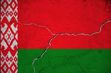 An image of the Belarus flag on a wall with a crack.