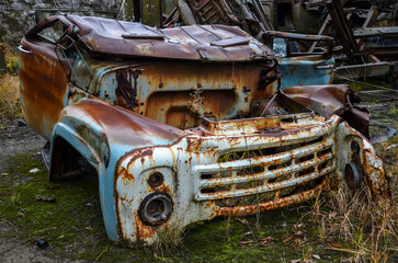Abandoned cab of an old rotten rusty soviet truck. Recycling scrap