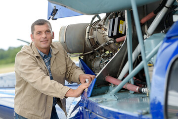 a helicopter technician looking at the camera © auremar