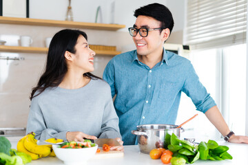 image of a couple cooking together