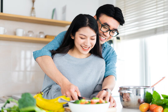 image of a couple cooking together