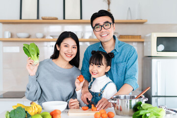 image of an asian family cooking at home