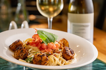Blackened Scallops with Spinach, Tomato and Prosciutto over Linguine