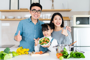 image of an asian family cooking at home