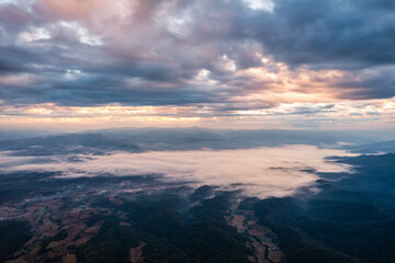 Fototapeta premium Viewpoint of Doi Dam with Doi Luang Chiang Dao mountain and foggy in the valley at the morning in national park