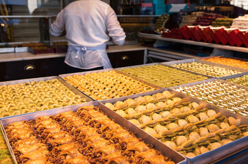 Various Turkish Baklava pastry dessert for sale at a confectionery on a street of Istanbul, Turkey. Baclava was one of the most popular sweet pastries of Ottoman cuisine