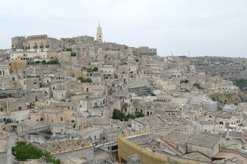 Pascoli viewpoint in Matera on the old city with the Cathedral bell tower on the top of the hill in the background