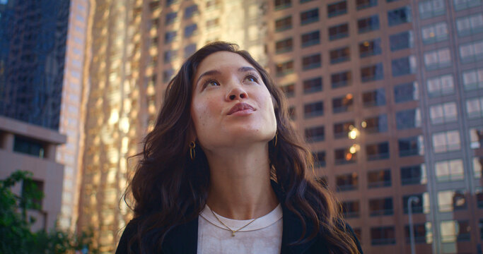 Portrait Of Woman Looking Up On Buildings. Asian Female Exploring City Close Up.