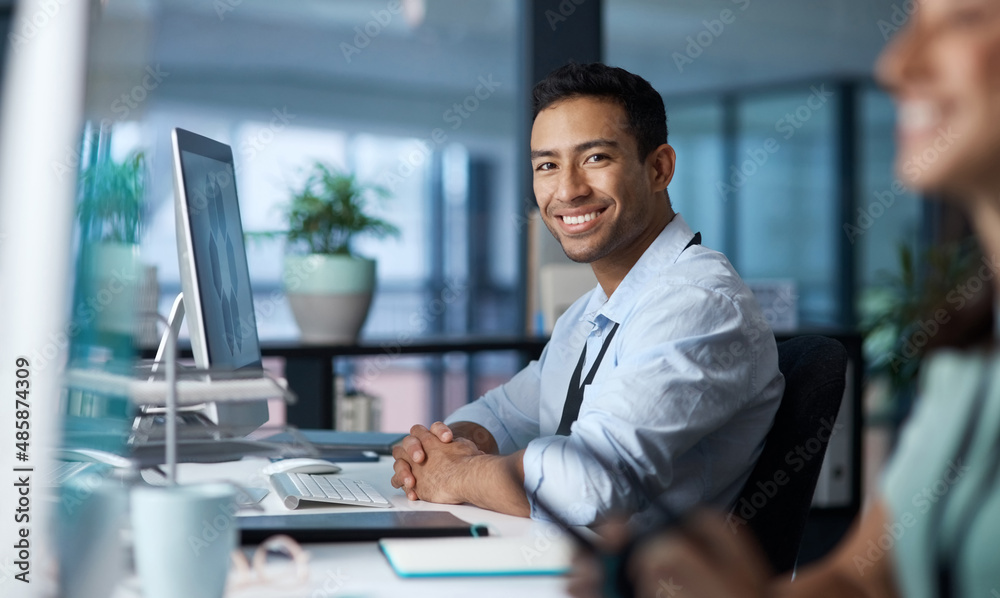 Poster your quality of work determines your worth. shot of a young businessman using a computer in a modern