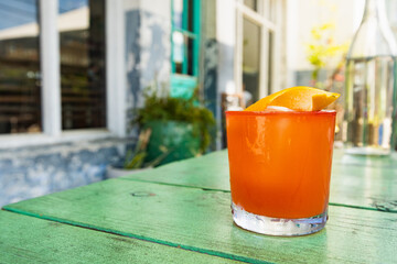 A cocktail rests on an outdoor table at a Charleston restaurant