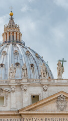 Obraz premium Dramatic view over Saint Peter Basilica in Vatican city, in the center of Rome, Italy, with heavy clouds.