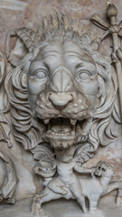 Ancient figure of a fearful lion head in Rome, Italy, closeup, details.