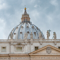 Fototapeta na wymiar Dramatic view over Saint Peter Basilica in Vatican city, in the center of Rome, Italy, with heavy clouds.