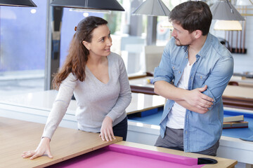 seller and costumer in a billiards shop