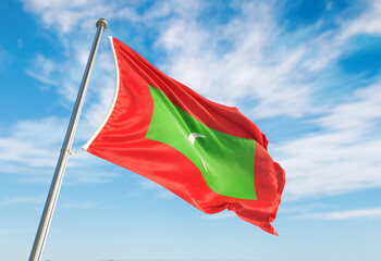 Realistic 3d wave Maldives flag. flag of Maldives waving against the backdrop of a blue sky