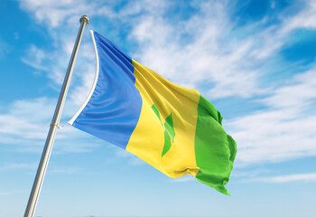 3d rendering Saint Vincent and the Grenadines flag waving in the wind on flagpole. Perspective wiev Saint Vincent and the Grenadines flag waving a blue cloudy sky
