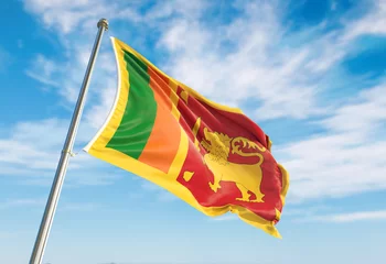 Foto op Aluminium 3d rendering Sri Lanka flag waving in the wind on flagpole. Perspective wiev Sri Lanka flag waving a blue cloudy sky © Adil