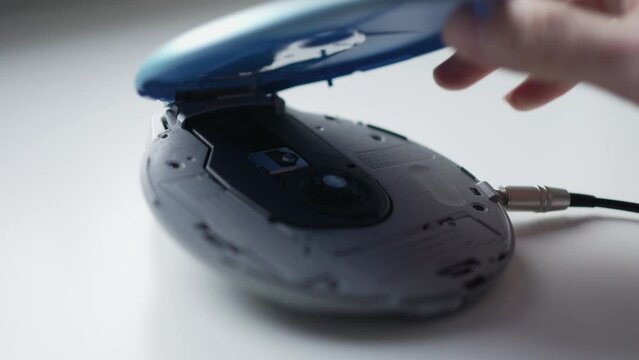 Using a Vintage Portable CD Player To Listen to Music from a Compact Disc