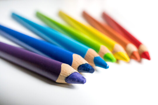 Rainbow color drawing pencils detail on white background