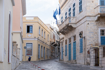 Greece. Ermoupolis Syros island. Stone paved street, neoclassical building, traditional architecture