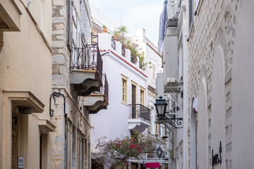 Fototapeta na wymiar Greece. Ermoupolis Syros island, Cyclades. Traditional architecture, Narrow street and balcony