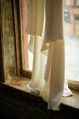 wedding dress on a vintage wall with white elopement dress