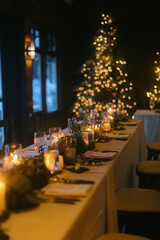 Fototapeta na wymiar Wedding dinner tables on an evening elopement celebration at Christmas time
