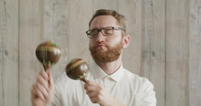 office worker with glasses dancing with maracas
