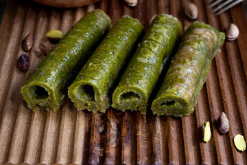 Turkish pistachio dessert on wooden background