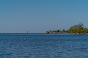 Fototapeta na wymiar Russia. Kronstadt. May 30, 2021. The Reef Fort and Tolbukhin Lighthouse are on the horizon.