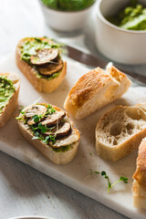 Baguette with guacamole, champignons mushrooms and micro green on white plate. Brunch ideas. Vegan protein source. healthy food. clean eating.