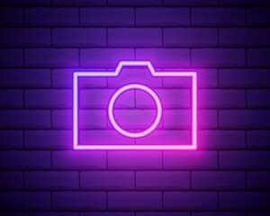 Neon illumination of the camera or camera. Bright is the camera. Modern vector logo, banner, emblem, poster, camera picture. Night neon sign. Light the inscription. Vector illustration.