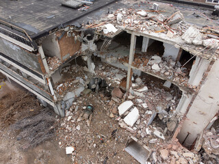 Demolition of a police station using building hydraulic shears, aerial