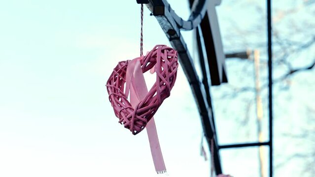 Decorative Fantastic Pink Wooden Heart Outdoor, Backdrop blurred nature. Symbol of Love, Valentine Day Holiday.Weeding. Creative toned footage. Selective focus 4K