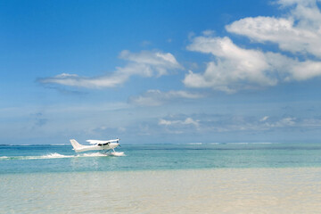 Seaplane begins to take off on the island of Mauritius in the Indian Ocean