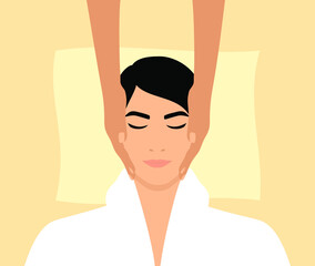 Facial massage in a beauty salon or spa. Beautician massages the face of a caucasian man