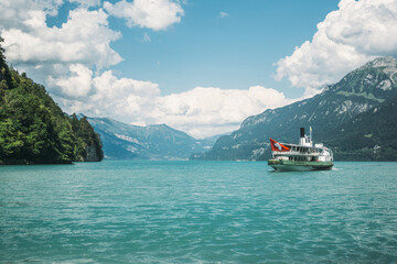 Ship on the blue water of lake Brienz in the Alps in Switzerland 