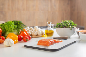 red fish and various vegetables in  kitchen