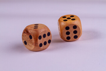 Two wooden dice isolated against a white background
