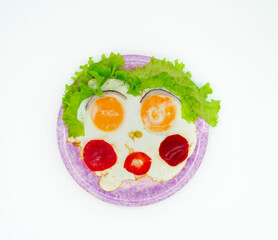 Fried eggs with vegetables in the form of funny cartoons, abstract, isolated on a white background