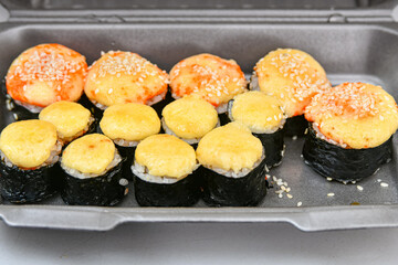 Sushi set. Various rolls, maki, nigiri in assortment in plastic packaging.