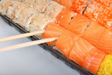 A variety of Japanese sushi sets with shrimp, cheese, crab, salmon and eel wrapped in rolls.