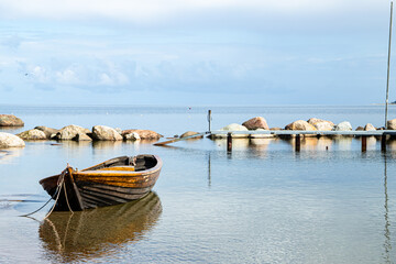 Kaesmu Estonia Baltics Beach and Stones Landscape Lonely Dream Boat at the dock