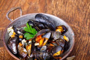 mussels on dark wood