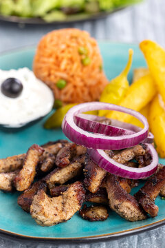 greek gyros on a plate with fries