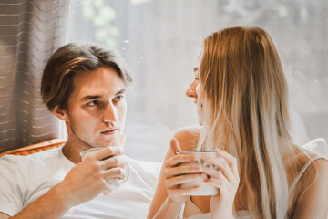 Young just married couple traveling in camper,house on wheels,trailer,motor home.Love romantic road travel,freedom life. Small bed,bedroom in van.Wanderlust vacation,weekend. Girl,guy,happy adventure