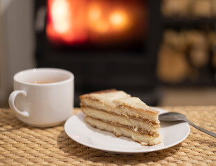 Baking and tea on the background of the fireplace.