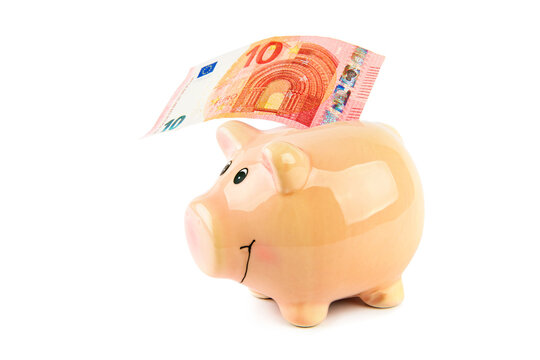 Piggy bank and euro banknote isolated on white .