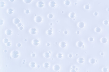 Bubble white background texture. Gel for cleansing the skin of the face and body. Spa treatments, skin care. Bath foam, detergent. Slime